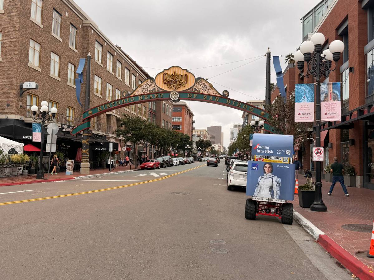 A Power Chariot parked on Fifth Avenue under the Gaslamp Quarter arch in downtown San Diego